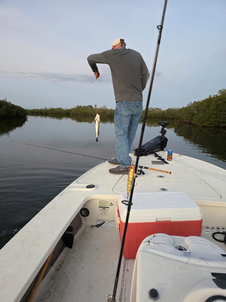 Mike catches a small redfish at Redfish Bay by West Port